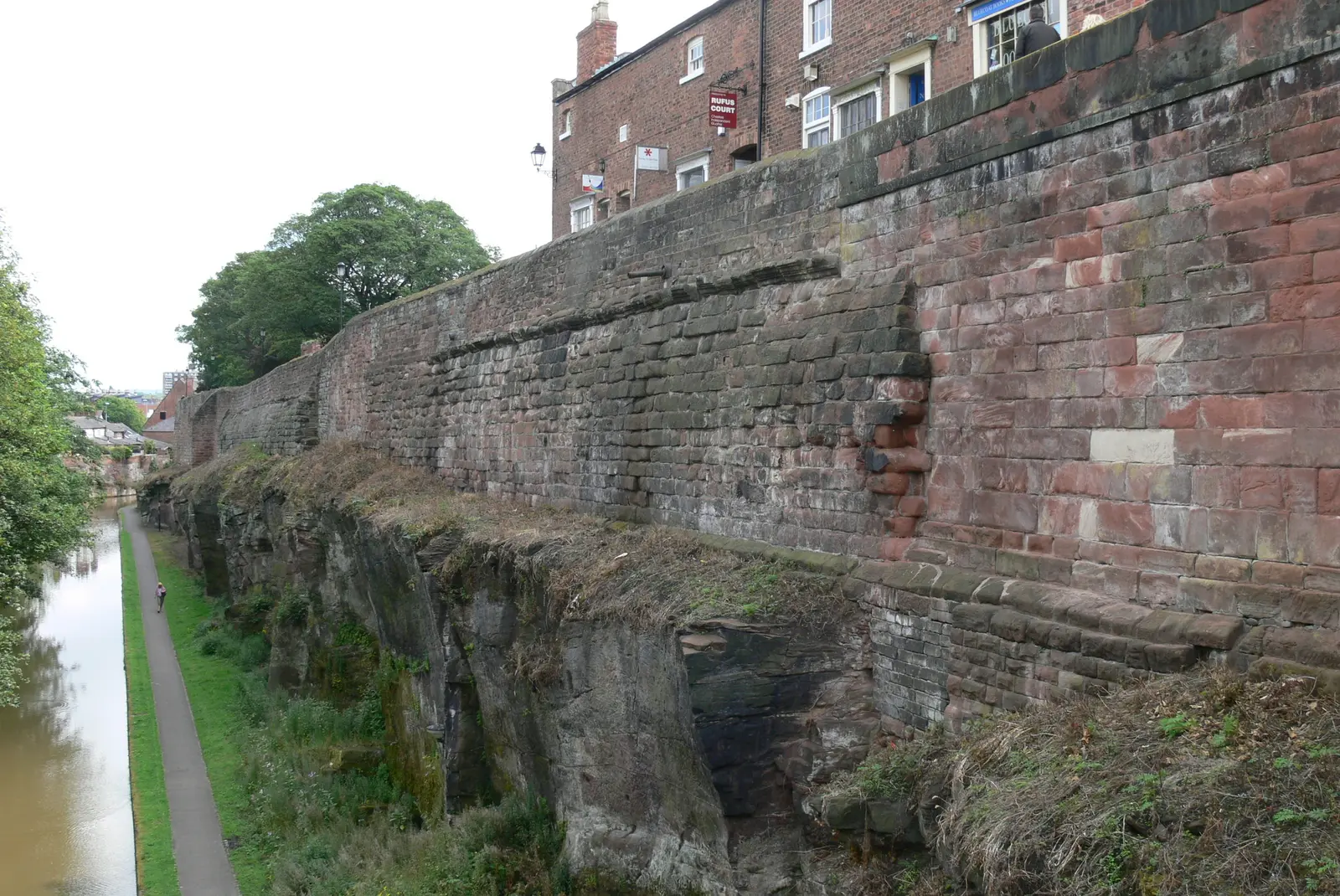 The Roman north wall of Chester today, its lower courses rising above the canal cutting.